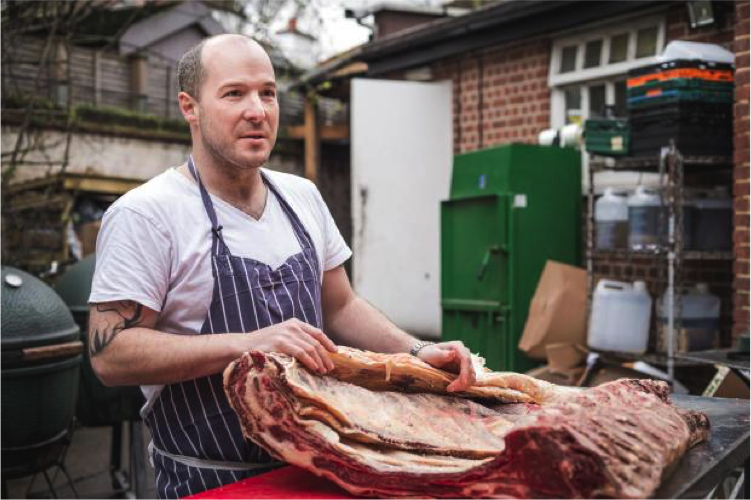 Butcher preparing meat